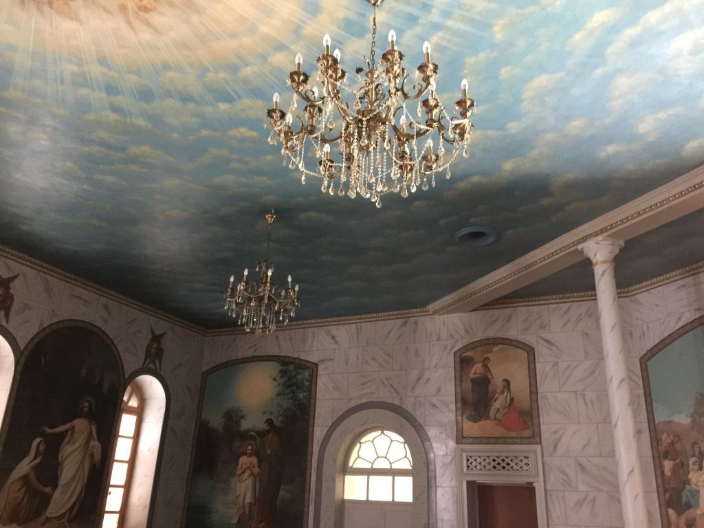 The carefully restored muraled ceilings and walls of the former dining room in the Russian complex (Jessica Steinberg/Times of Israel)